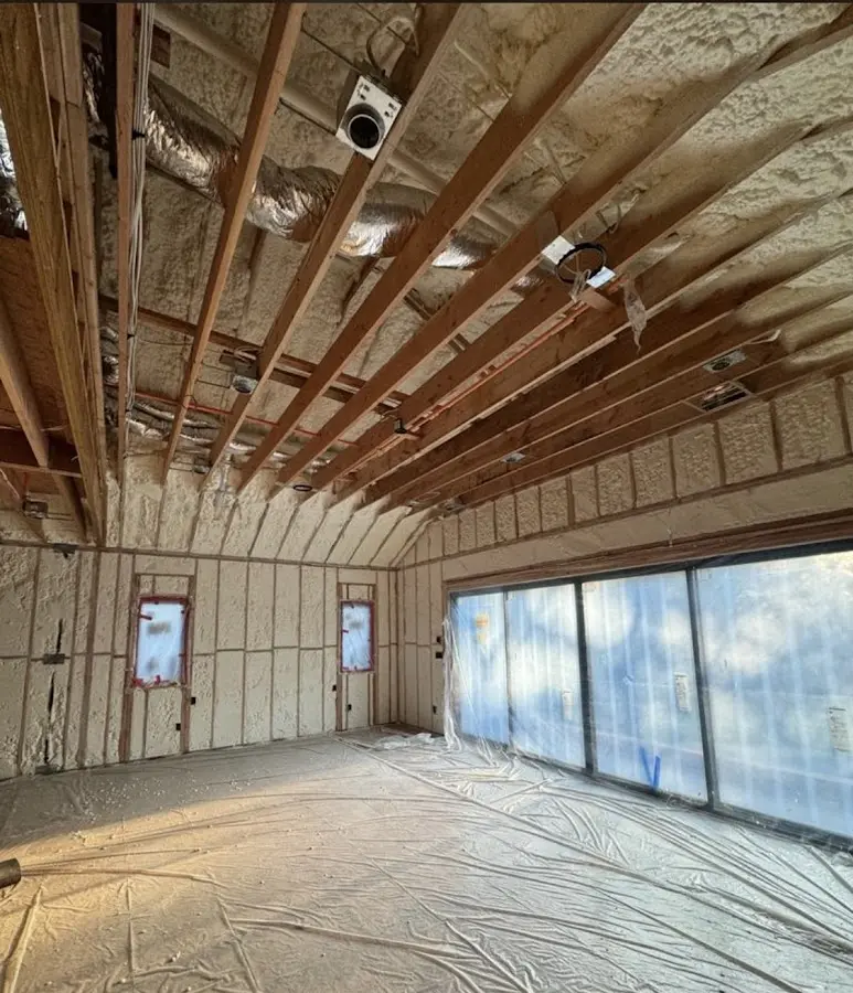 Interior walls and ceiling insulated with spray foam during new construction in Coralville